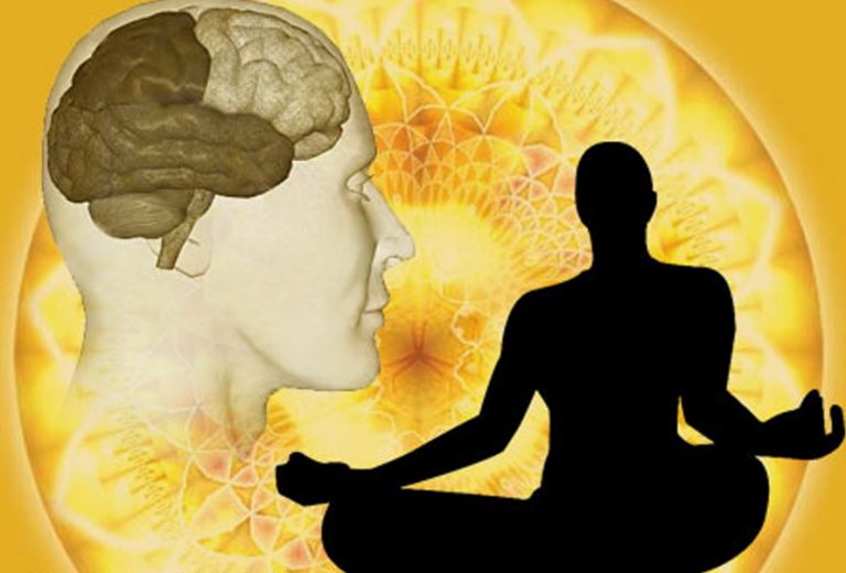 Silhouette meditating beside an illustration of the brain