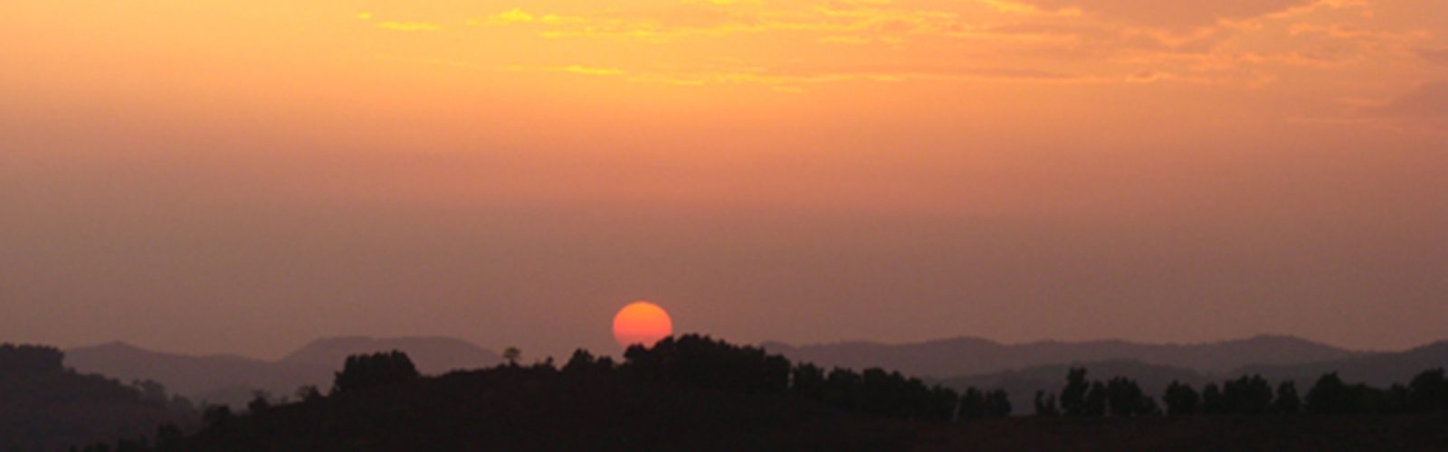 Sun setting over the hills near Anandkunj